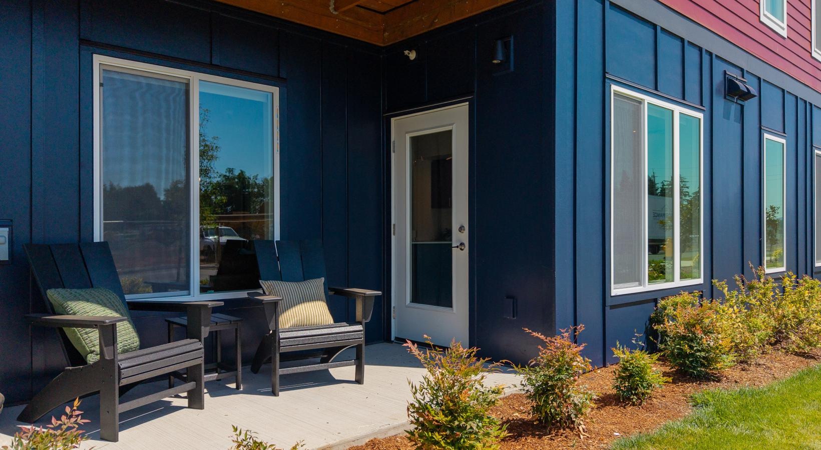 a house with a patio and chairs