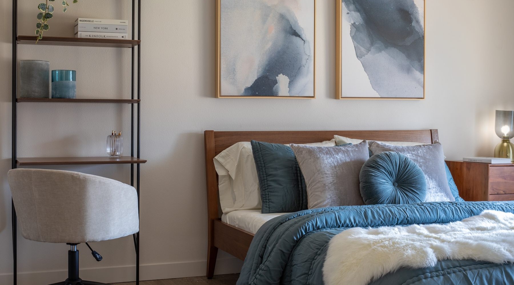 a bedroom with a bed and a chair