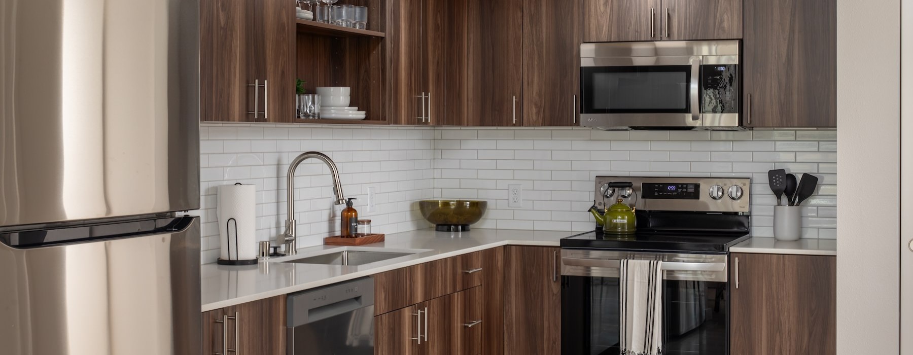 a kitchen with wooden cabinets