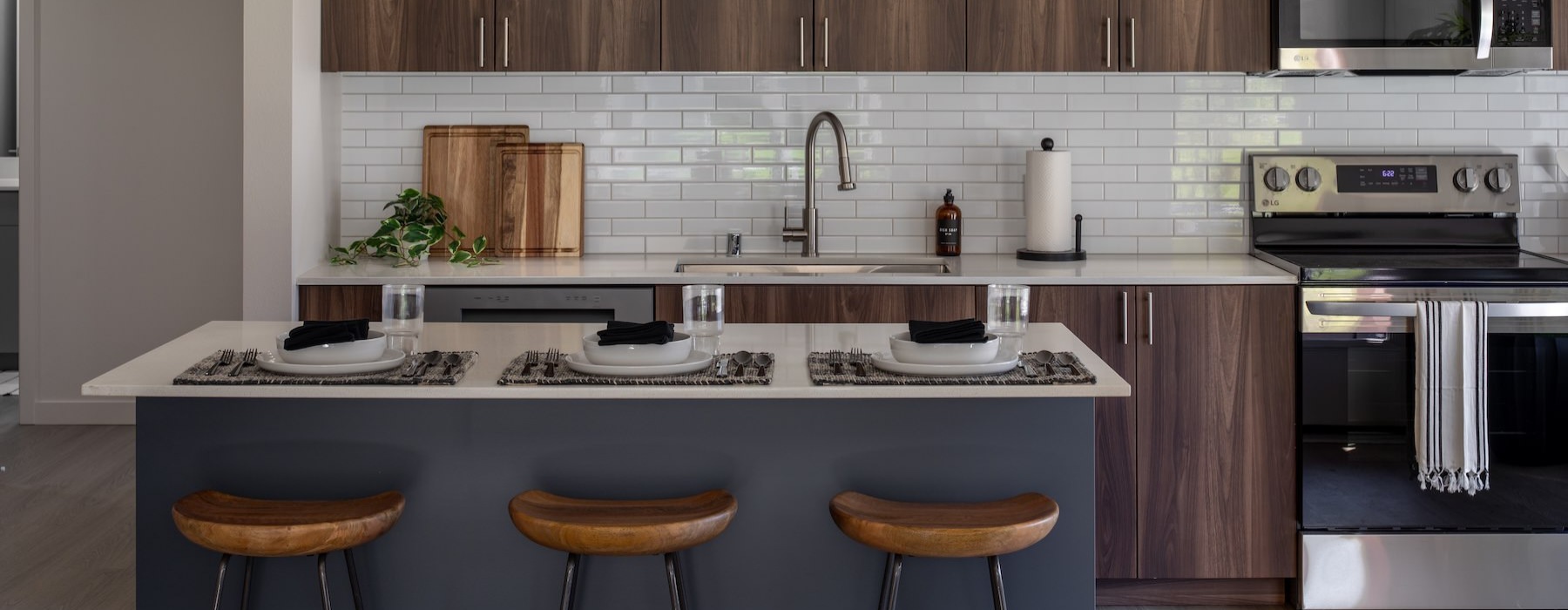 a kitchen with an island and stools